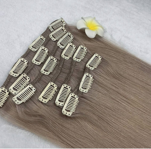 Set of hair extensions with clips on a white background